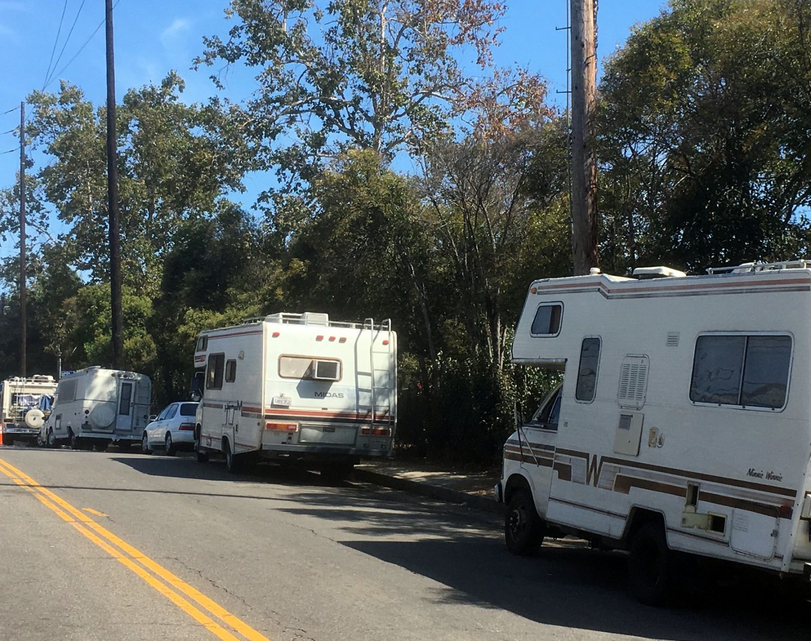 Campers and RVs parked on Bellevue in Angelino Heights